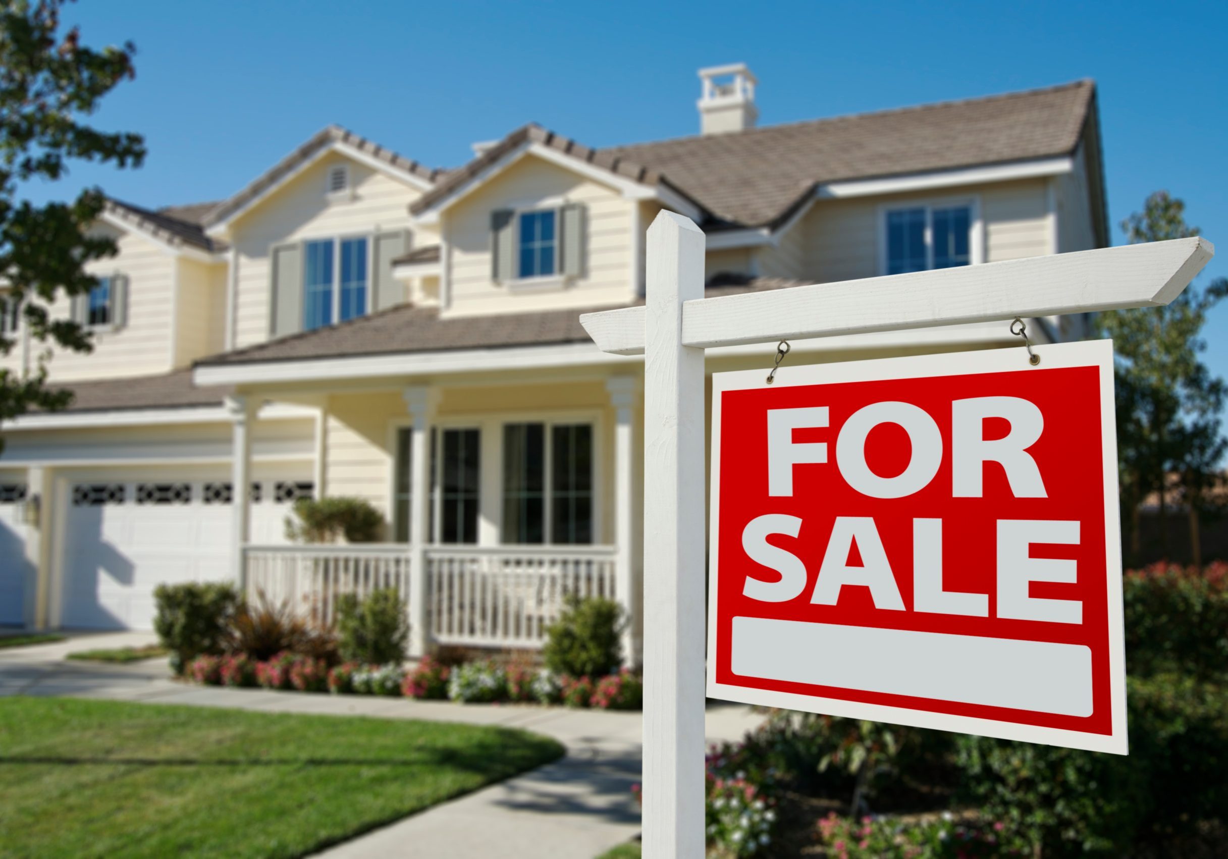 Home For Sale Sign in Front of New House.